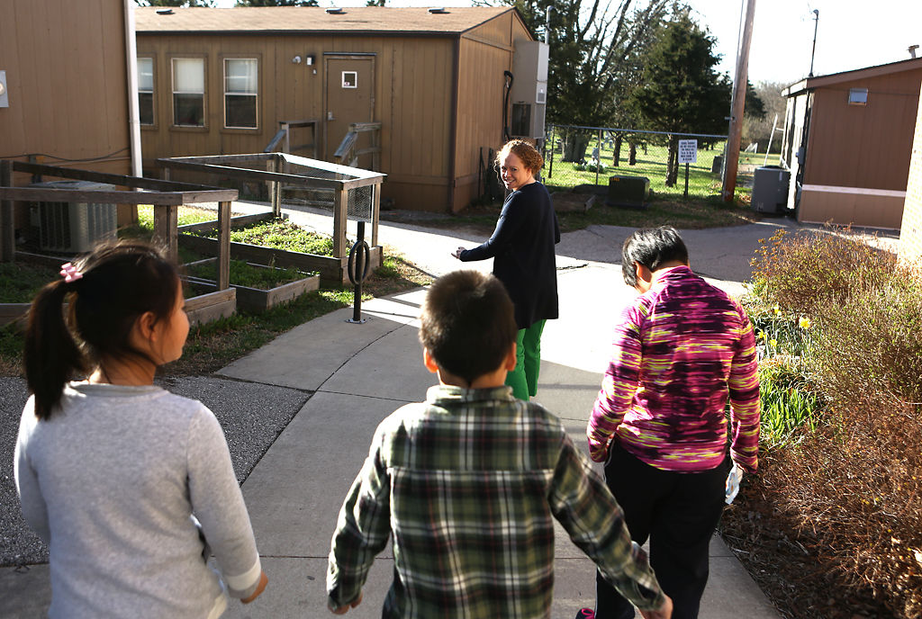 Katie Cook leads her students to her classroom